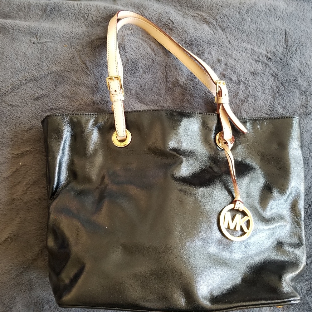 MICHAEL KORS like new Black and Vachetta leather with Michael Kors lining inside